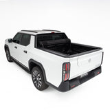 HSP Roll Mate manual roll-up tonneau cover open on an MG U9 ute tub, diagonal view